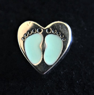 CH4007 Silver heart with blue baby foot prints.  Hard to find version with toes being black